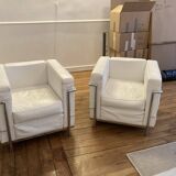 Pair of white leather and chrome armchairs