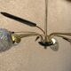 Brass and moulded glass chandelier, Bakelite arrow, 1950s, 5 lamps.