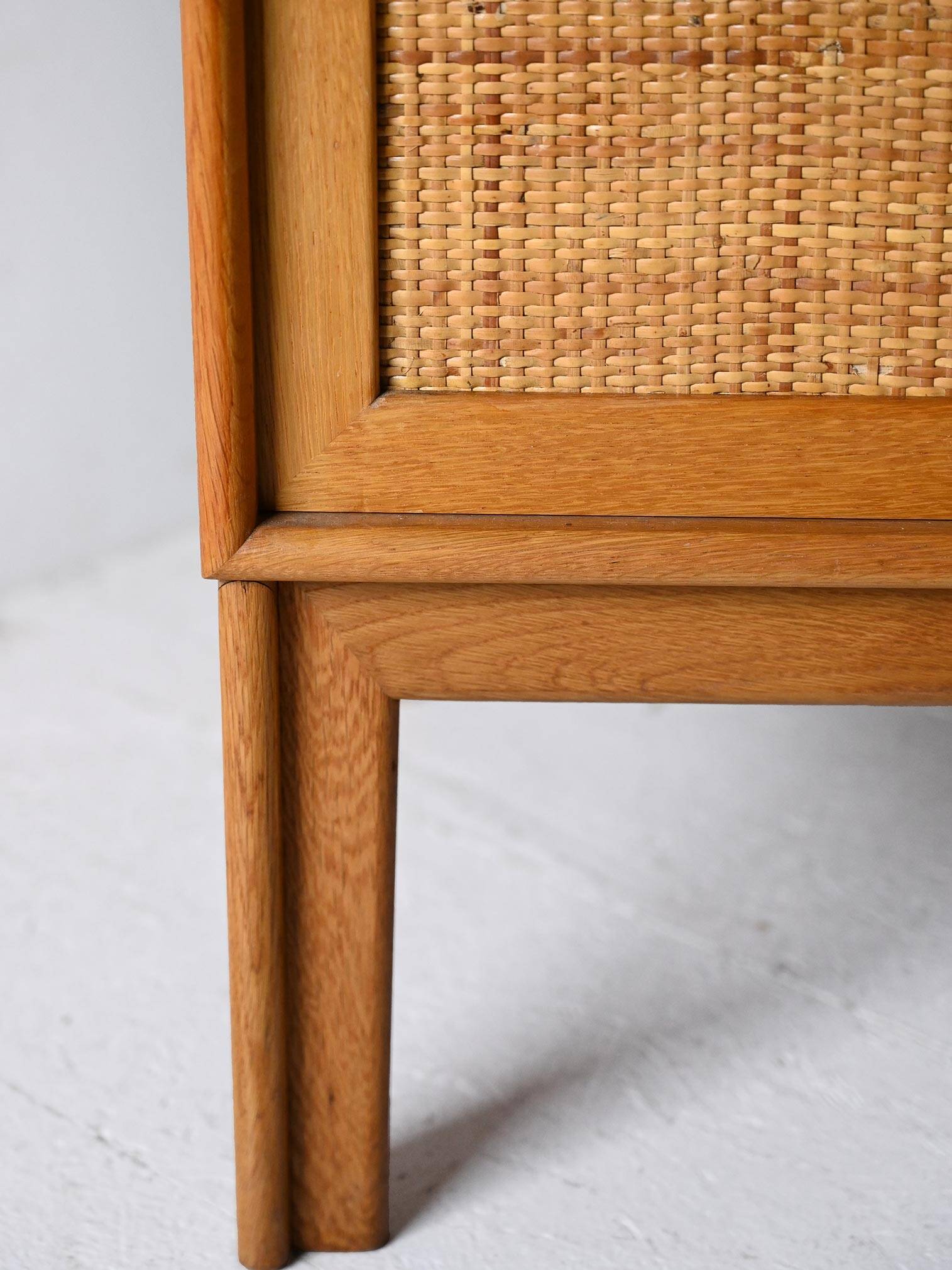 Scandinavian oak cabinet with woven rattan doors