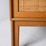 Scandinavian oak cabinet with woven rattan doors