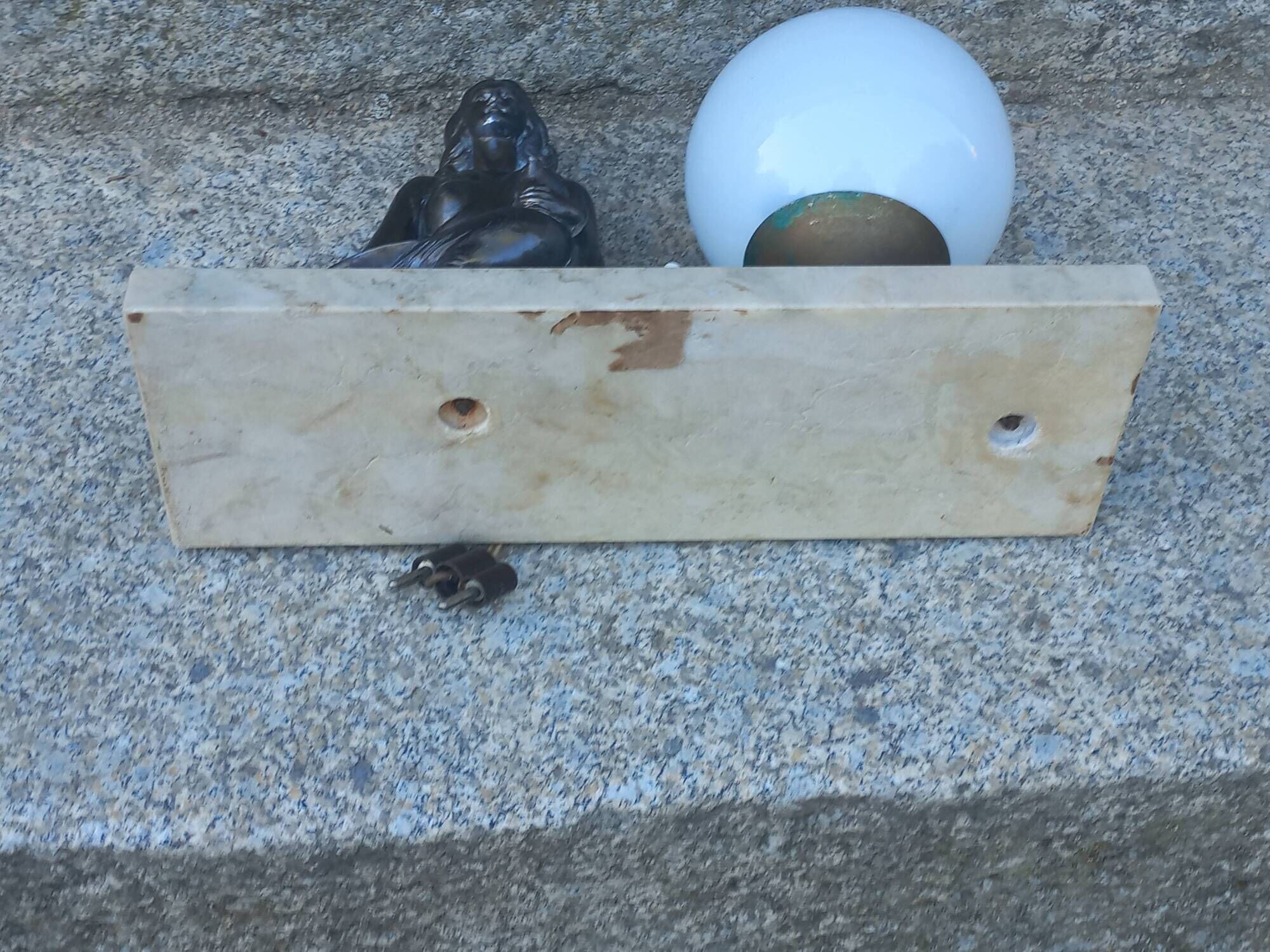 Art Deco lamp in cast iron and marble with a white opaline globe.