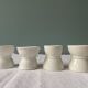 Set of 4 white porcelain diabolo shells