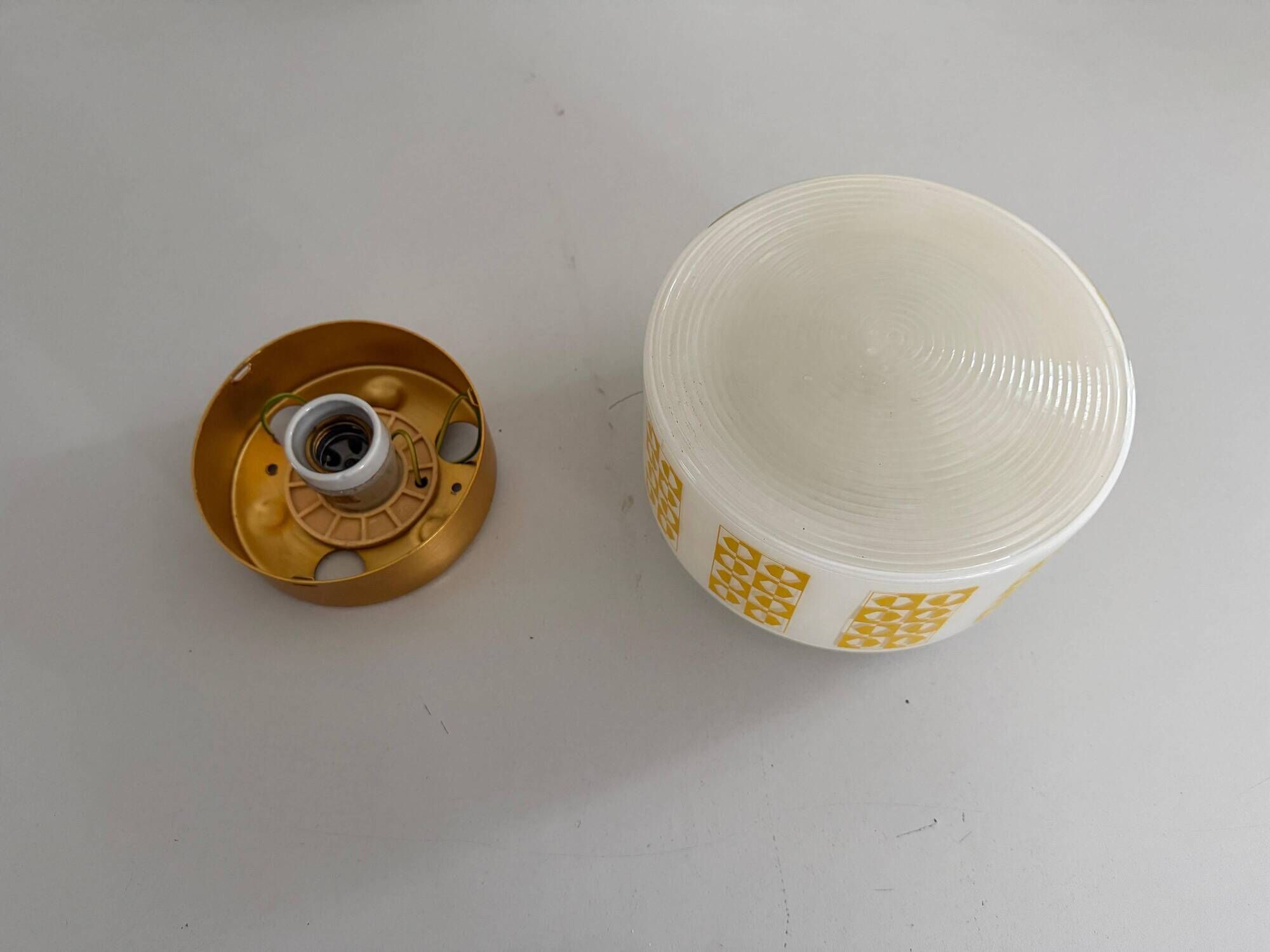 Ceiling light or wall sconce in opal glass with yellow decorations by VEB, 1950s, Germany.