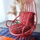 Restored vintage 70s armchair with custom-made Moroccan cushions, pink and red armchair