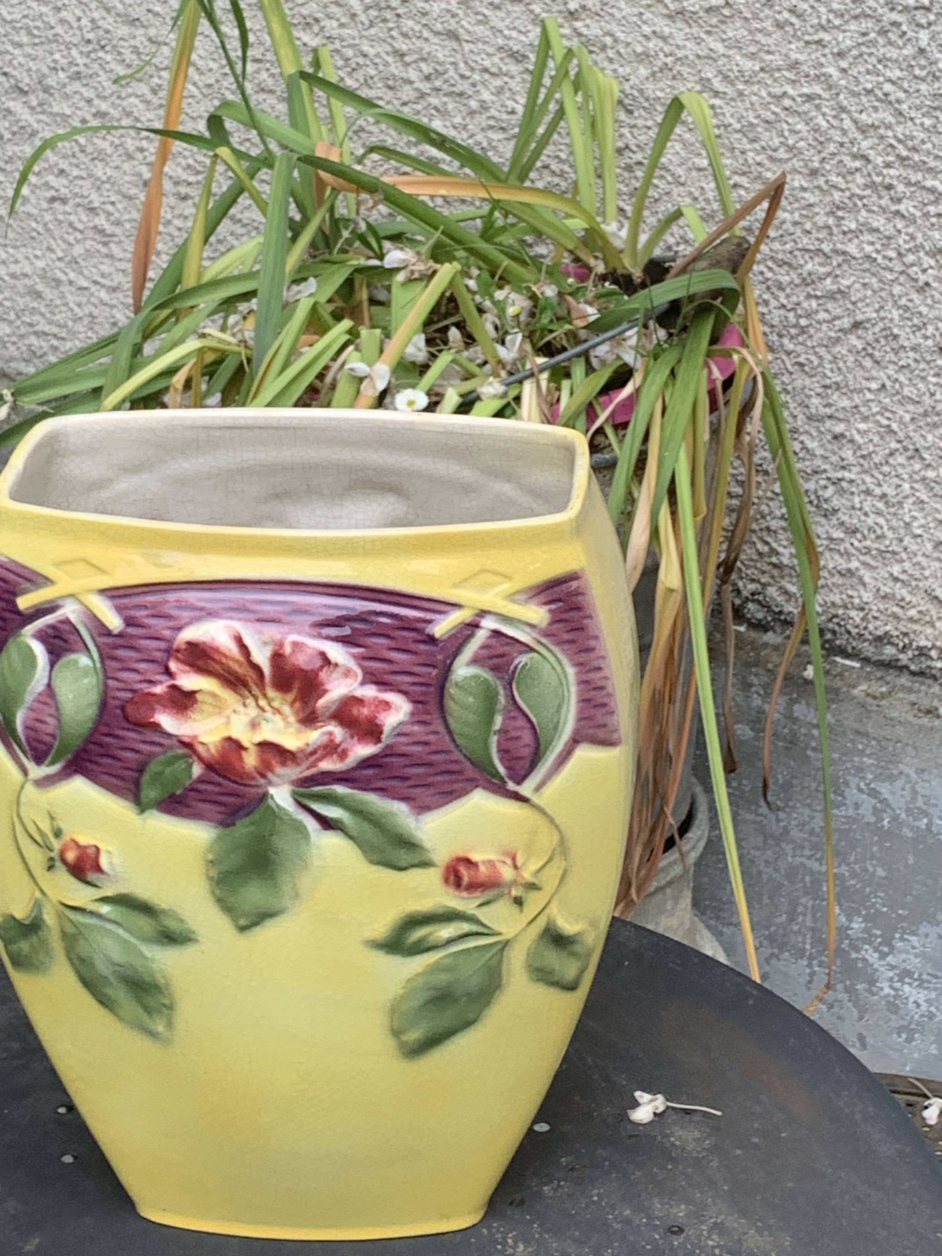 Yellow glazed ceramic slip vase with hawthorn pink flower motif