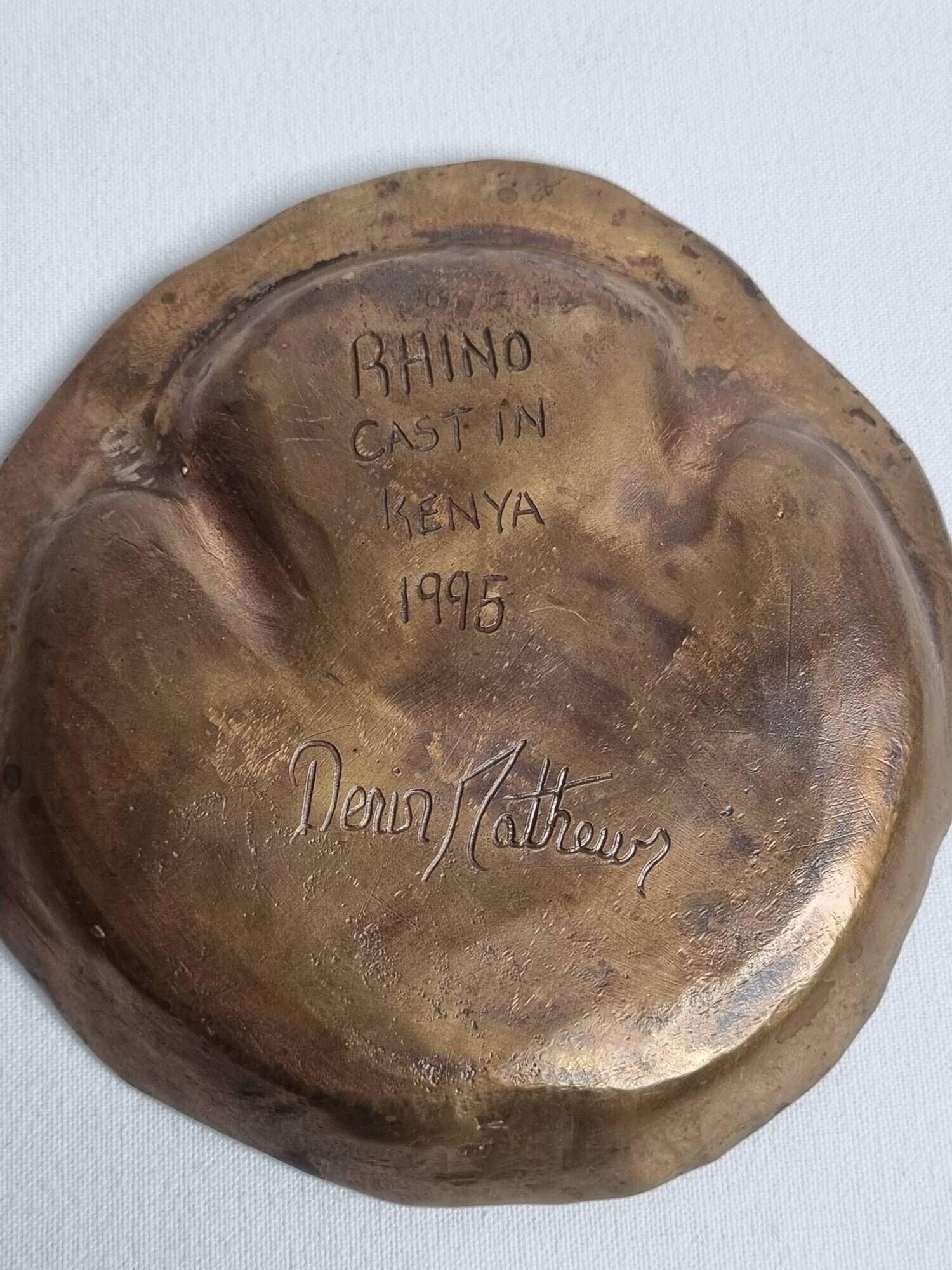 Bronze pocket emptier by Denis Mathews (1913-1997), "Rhinoceros Footprint" (12 cm), 1995