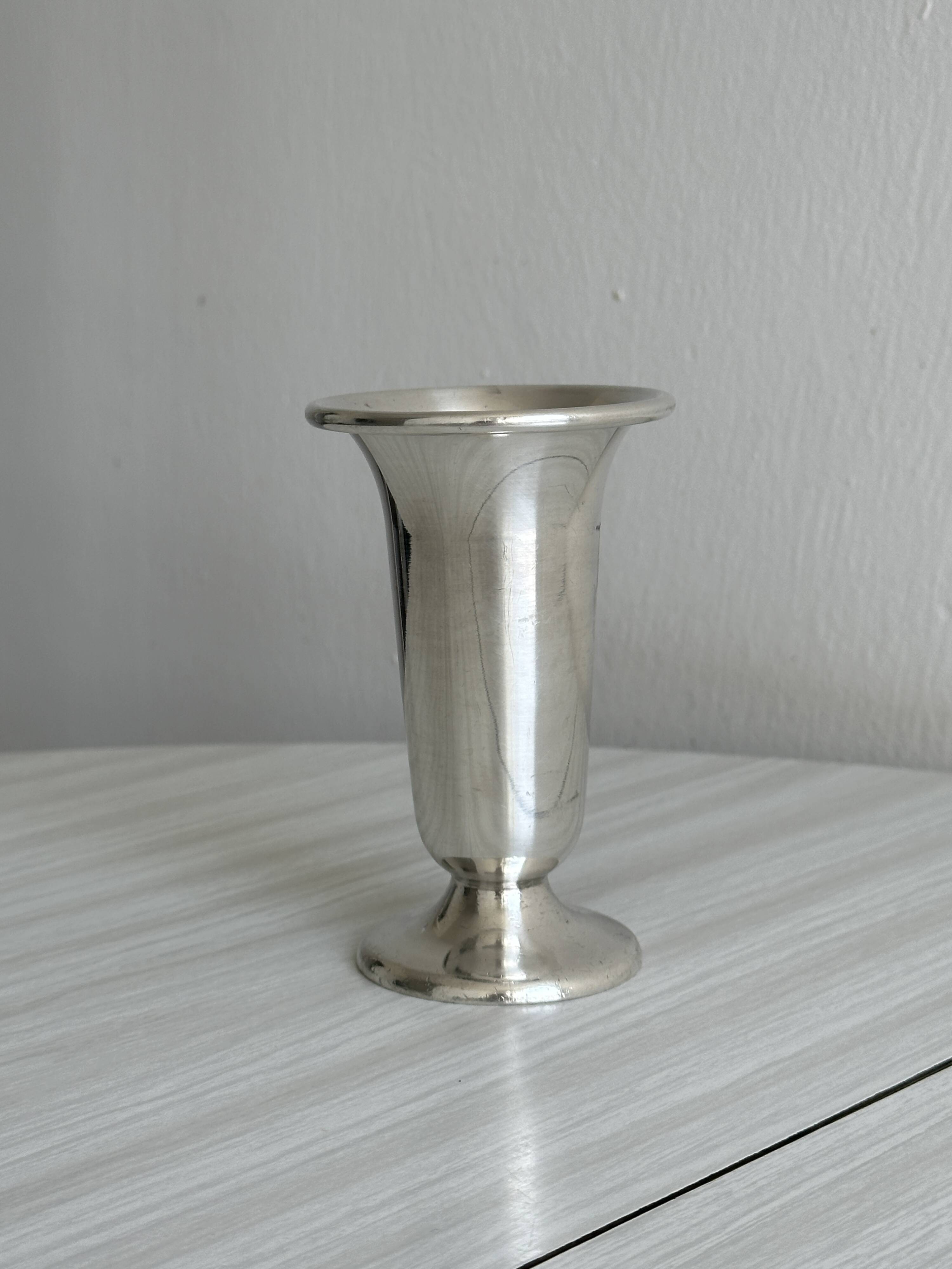 antique vase in shiny silver metal