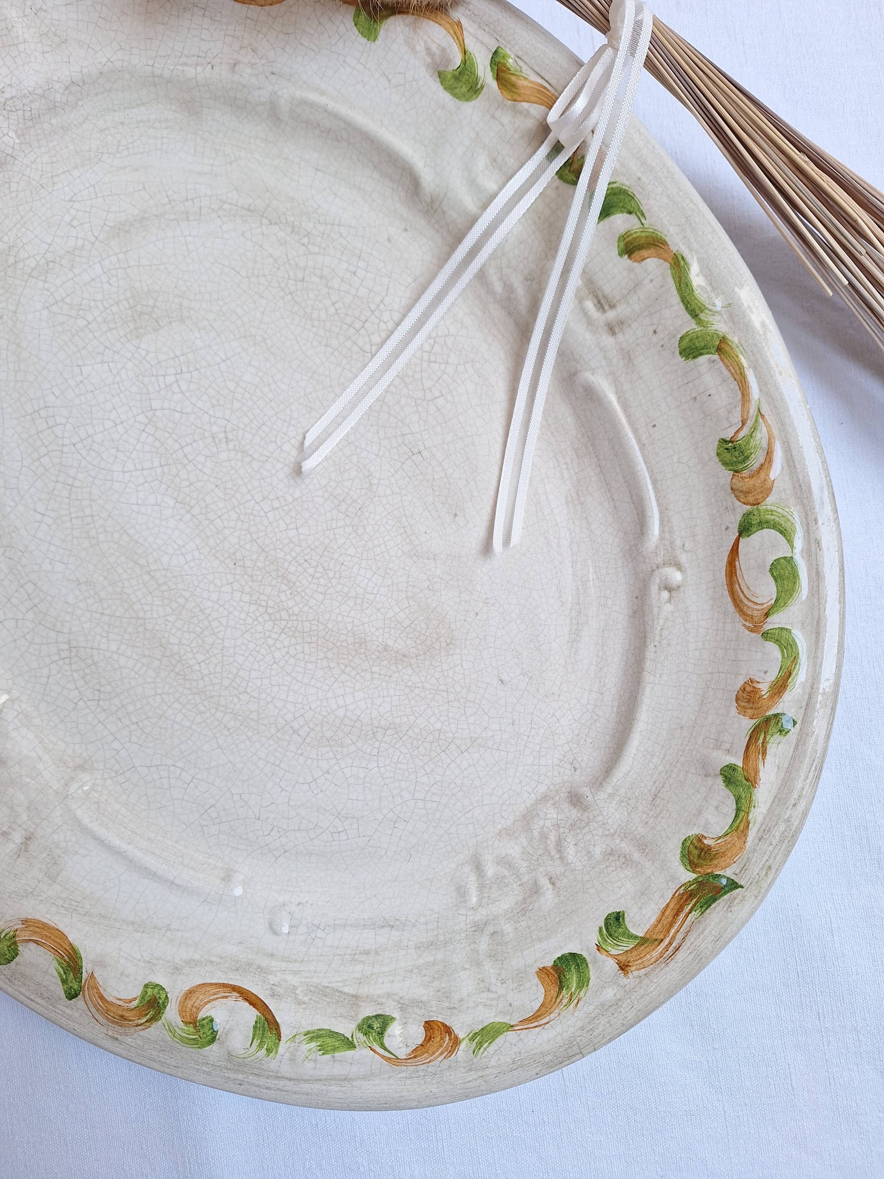 Oval plate, hand-painted meat platter in orange and green.