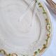 Oval plate, hand-painted meat platter in orange and green.