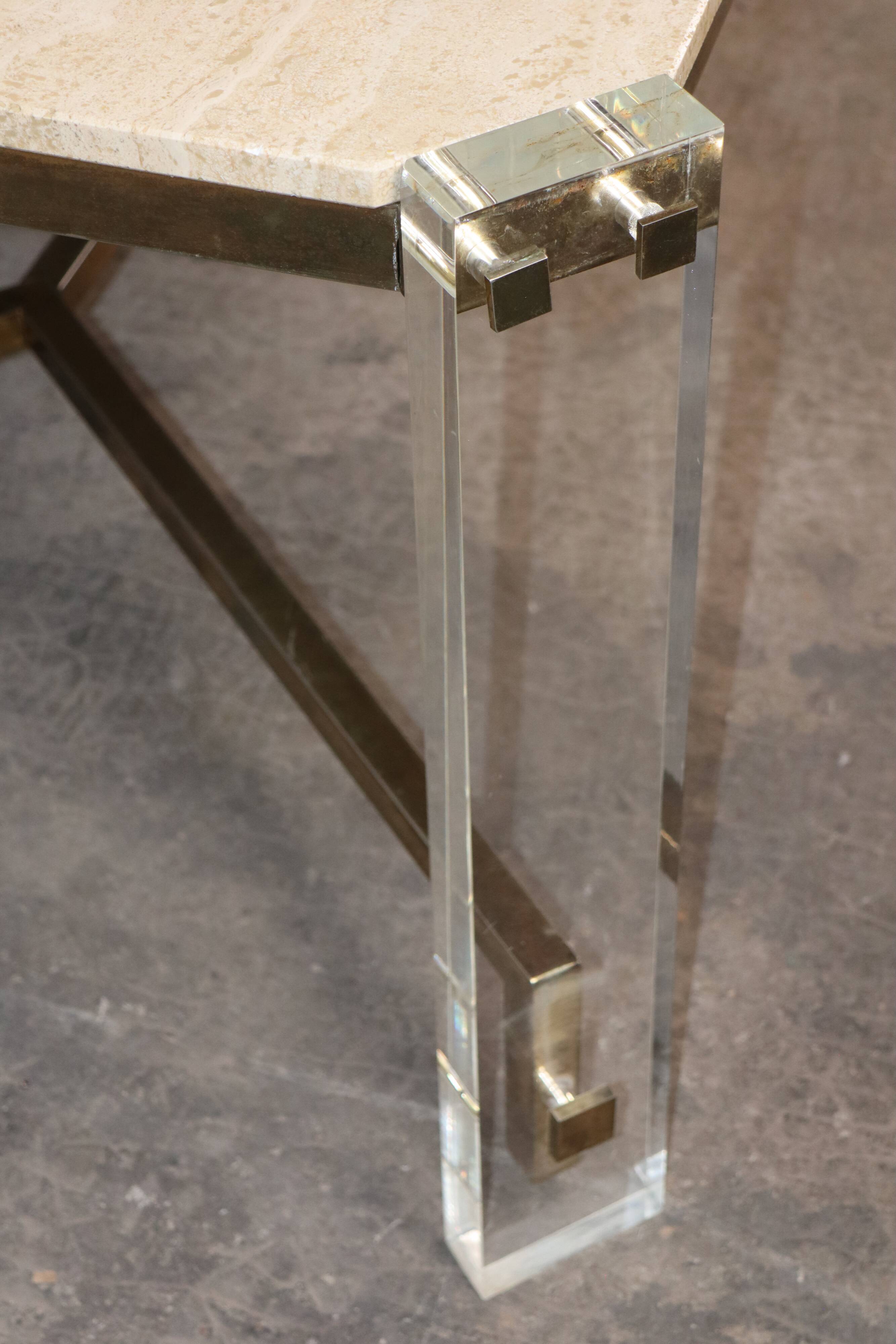 1970s dining table in travertine, gold metal and plexiglass.