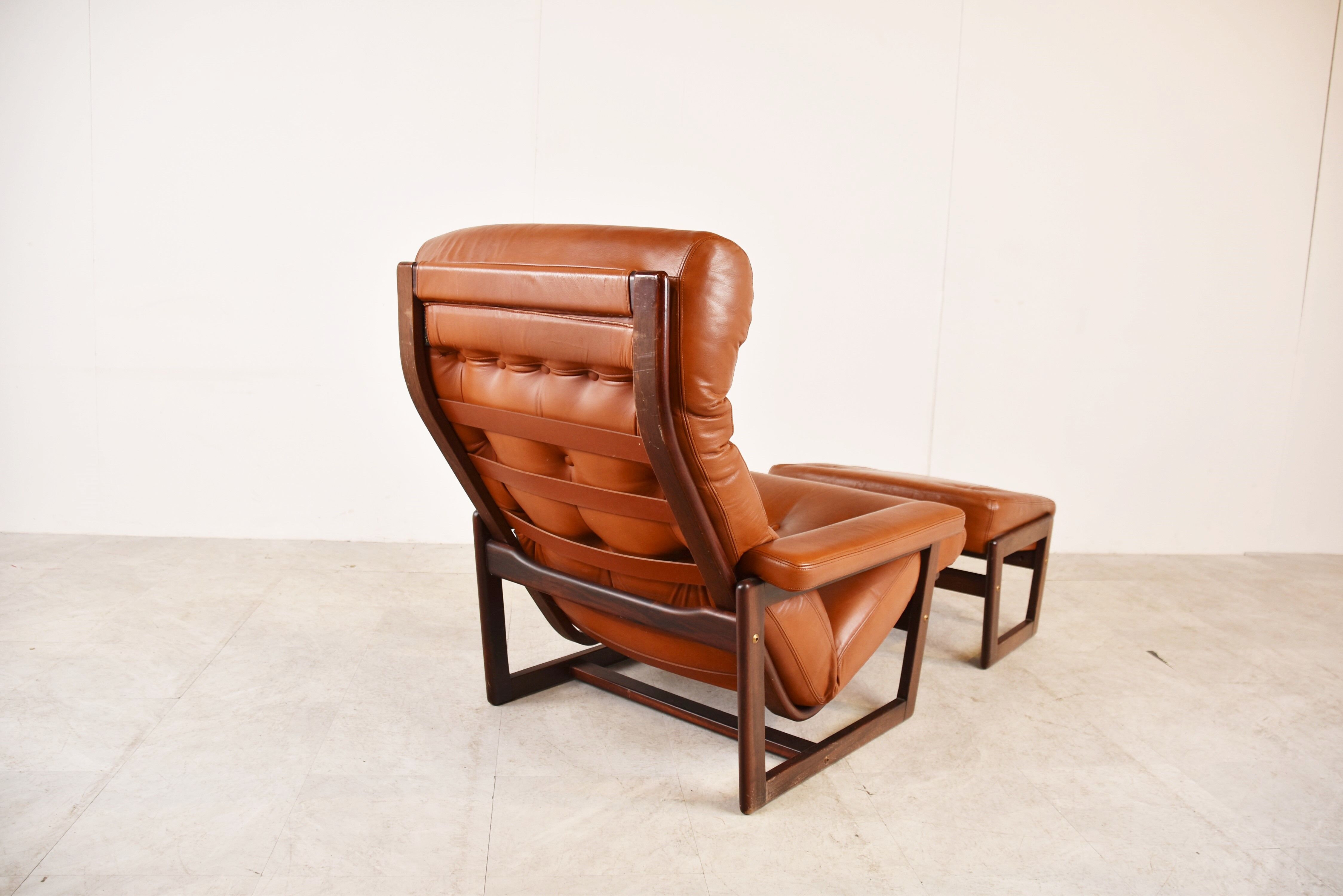 Vintage leather armchair with hocker, 1970s