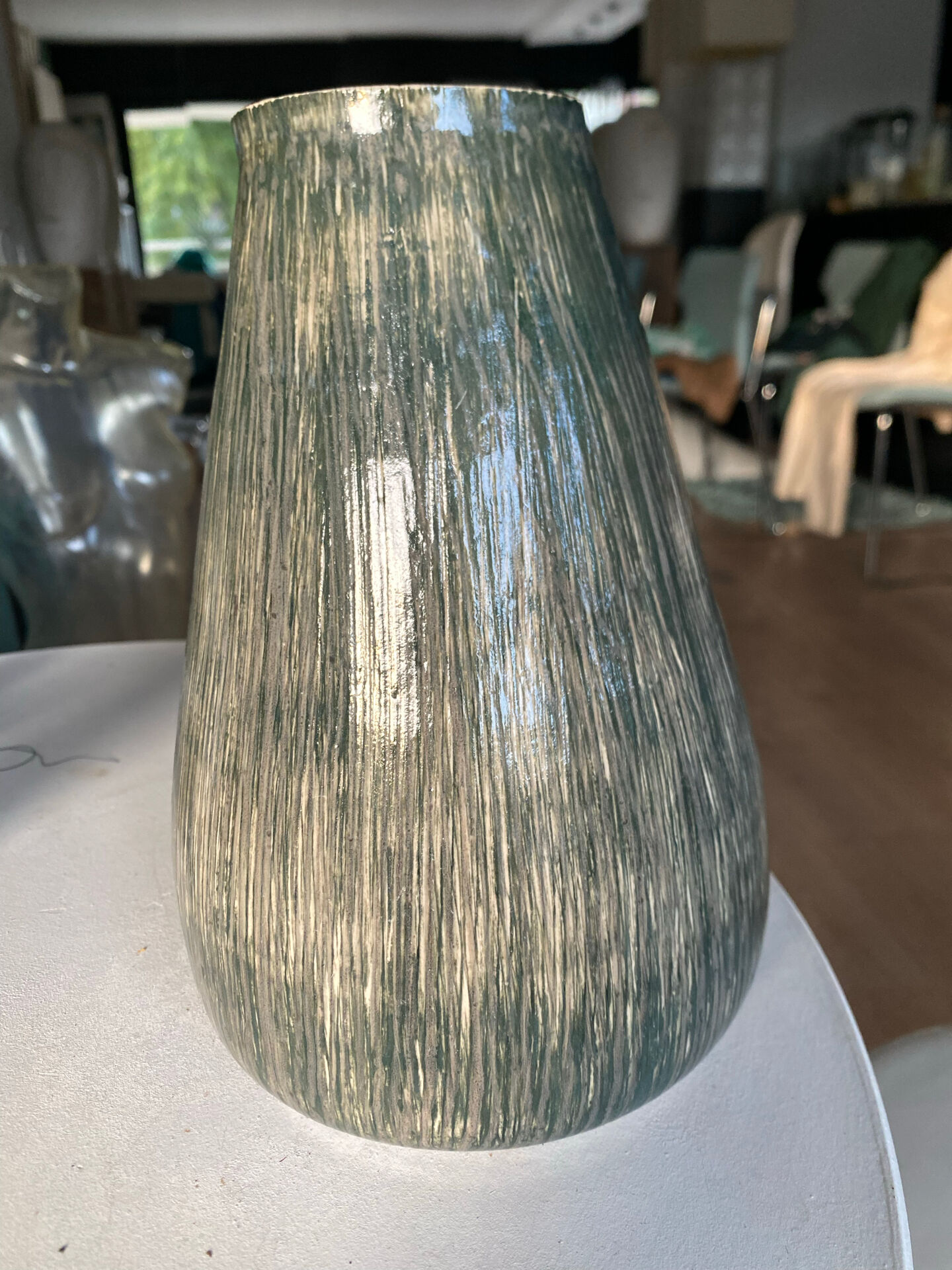 New green ceramic artisanal vase.