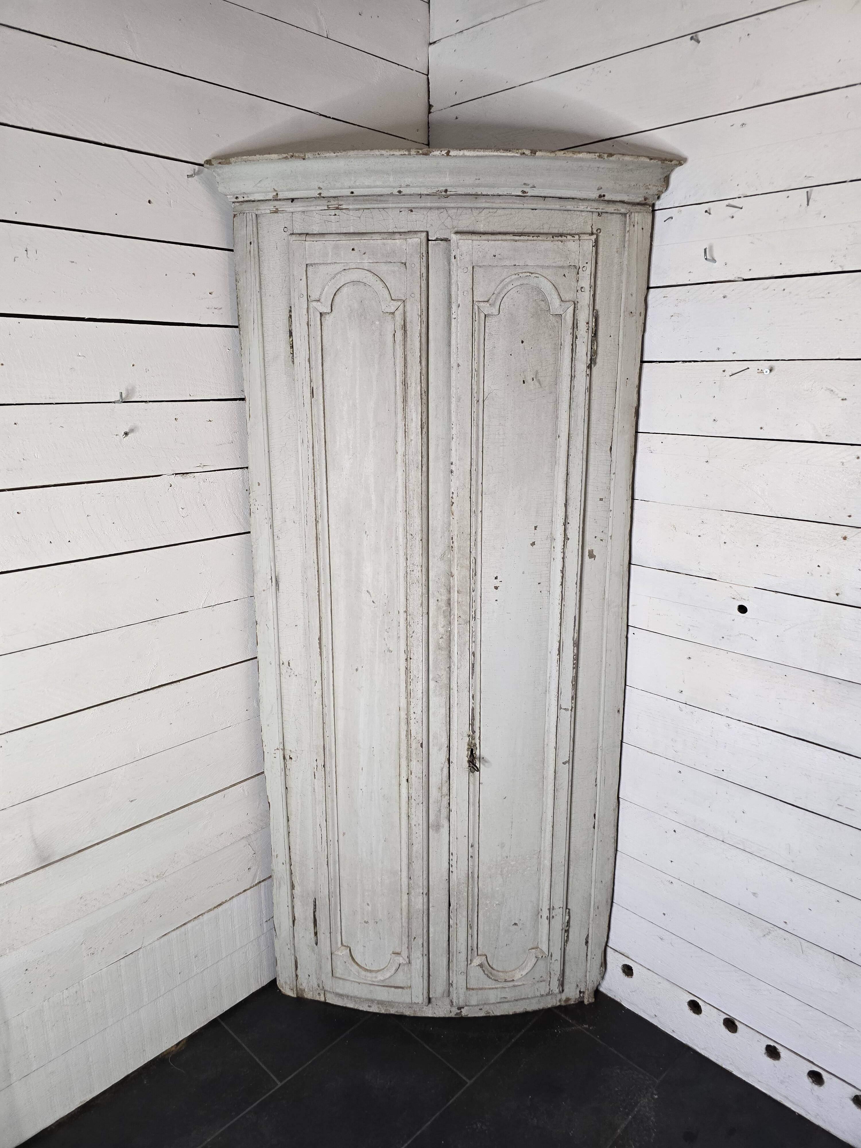 19th century curved corner cupboard in patinated oak