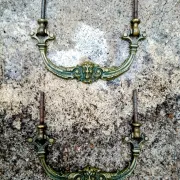 Pair of bronze furniture handles with a mask design, 19th century.