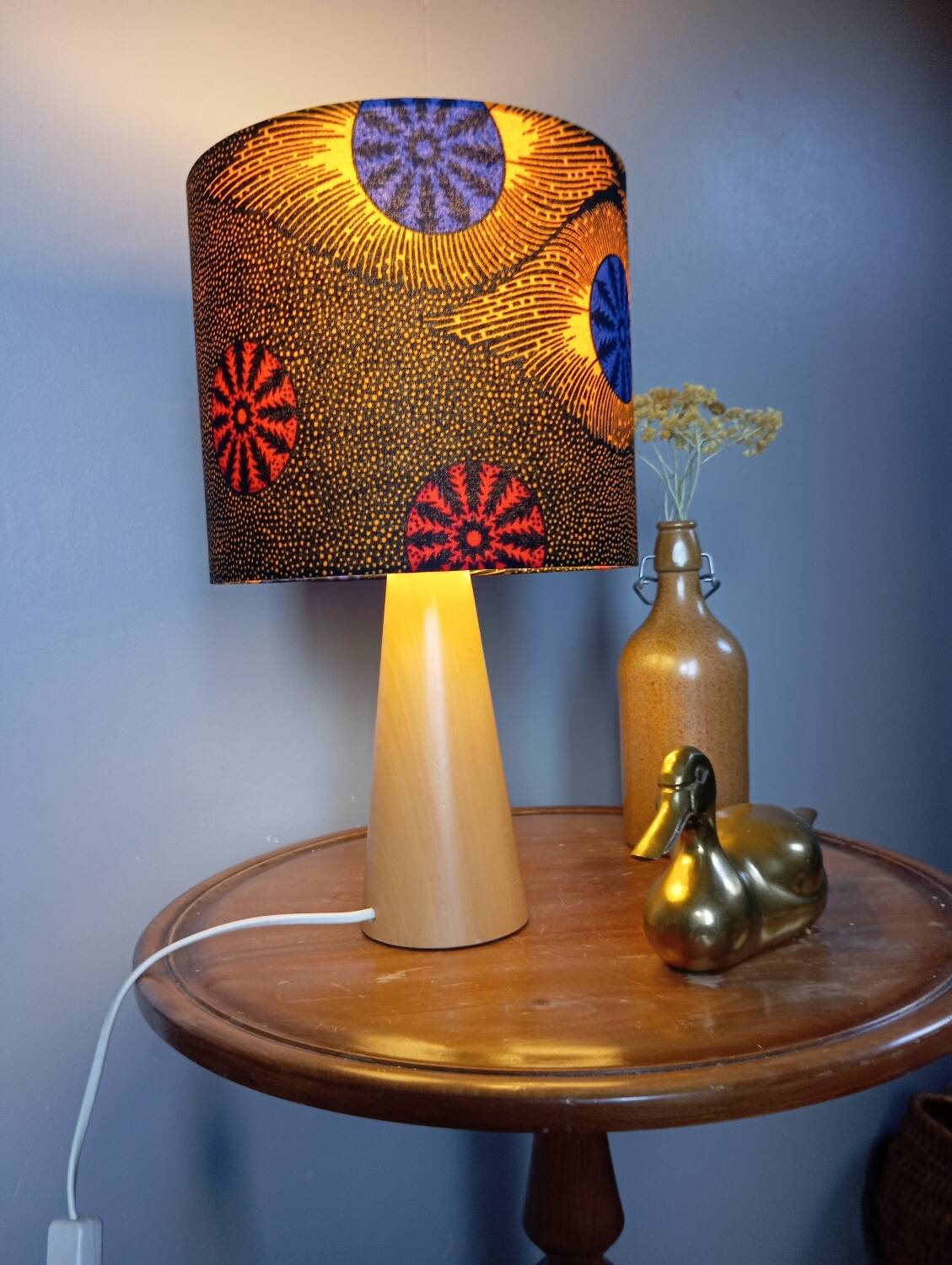 Table lamp in blond wood with handmade wax shade