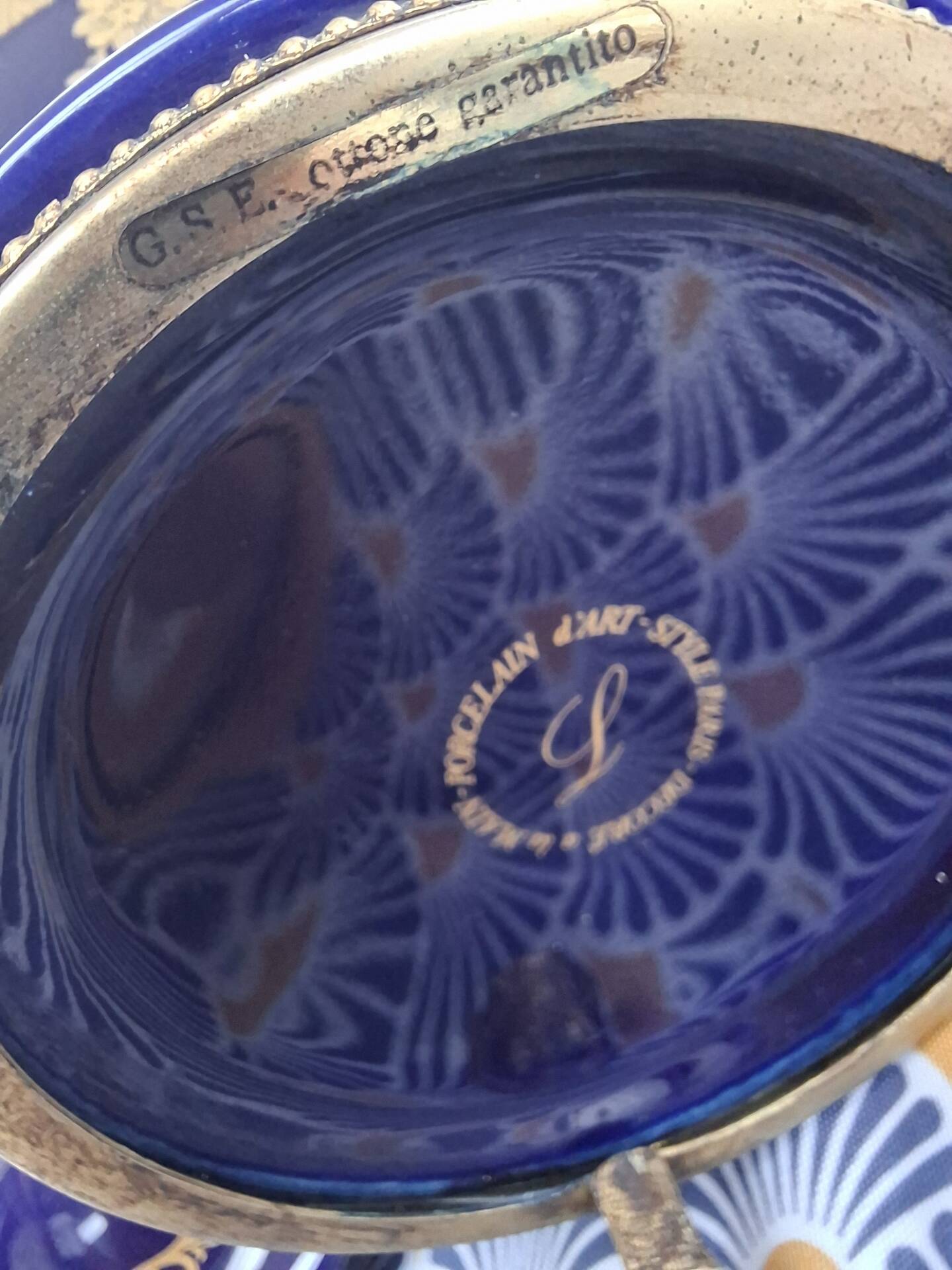 Cobalt blue porcelain bonbonnière with gold decoration on feet.