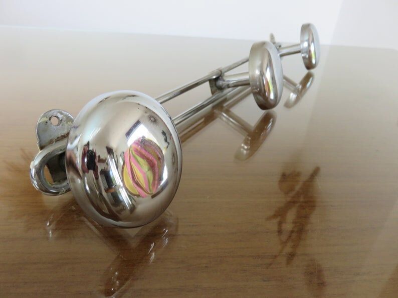 3-70s gold metal coat holder