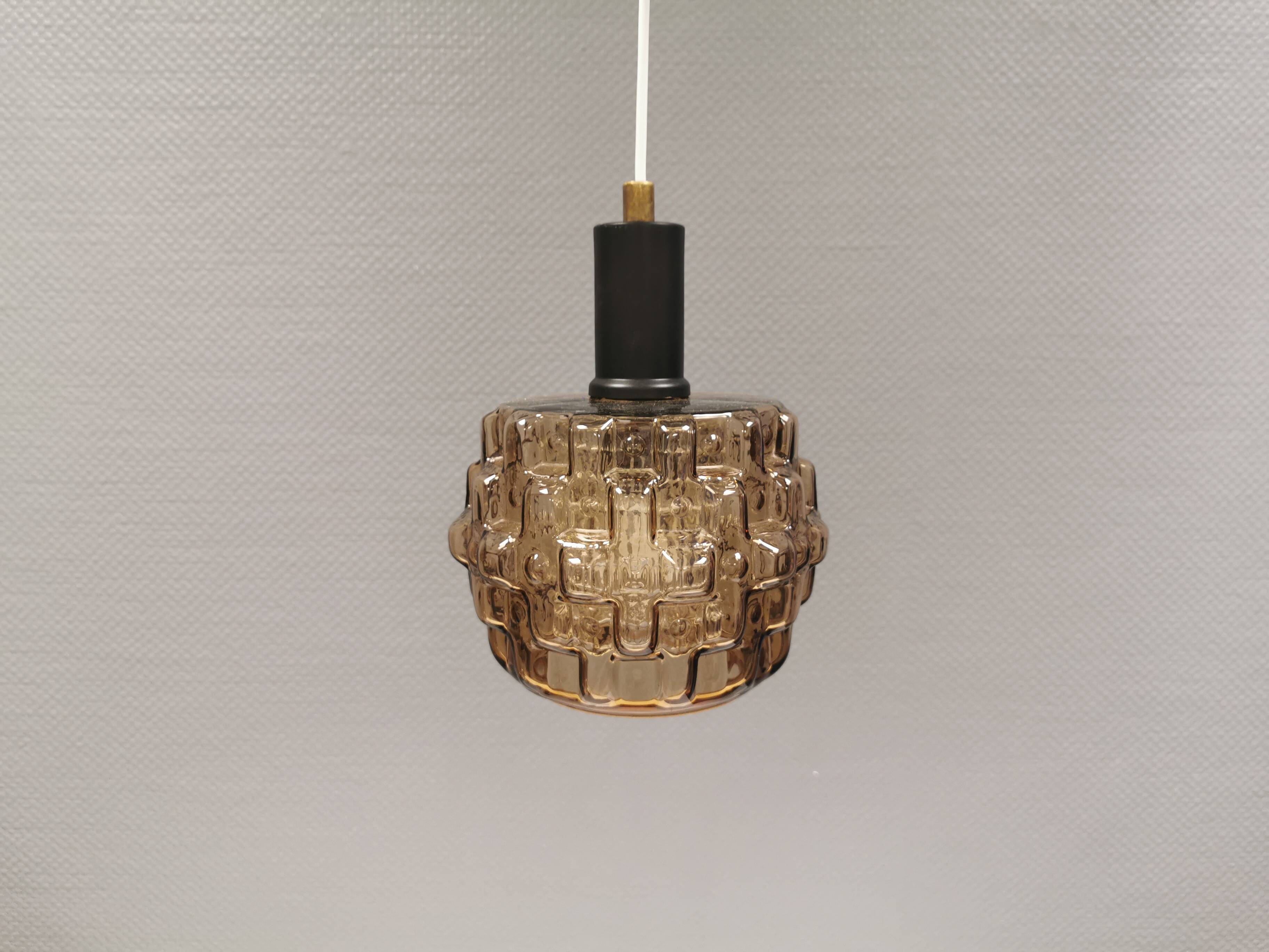 Older hanging lamp with champagne colored outer glass with inner shade of crystal glass.