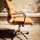 Light brown faux-leather office armchair
