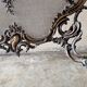 Spark screen, fire screen, bronze fireplace screen decorated with a covered cherub