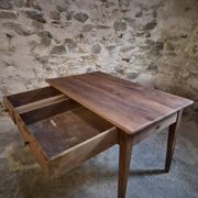 French antique dining table in cherry wood with two drawers, circa 1880–1920.