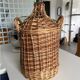 Give me a cylindrical jar with its wicker.