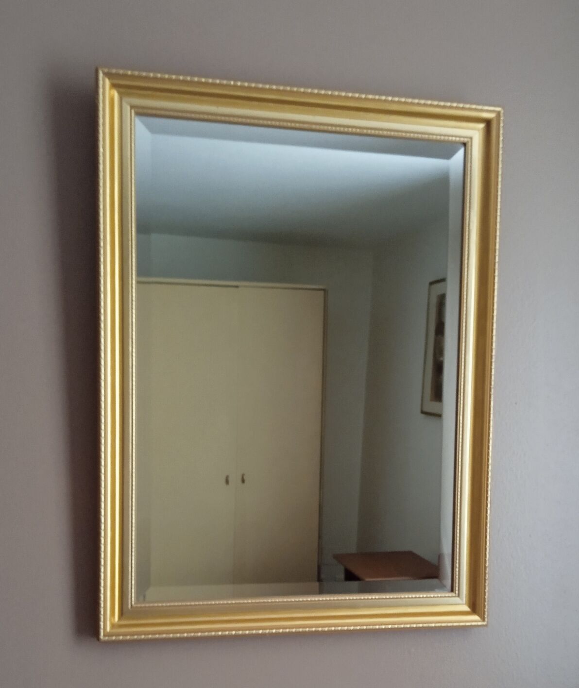 Beveled mirror with gold frame 60 x 80 cm
