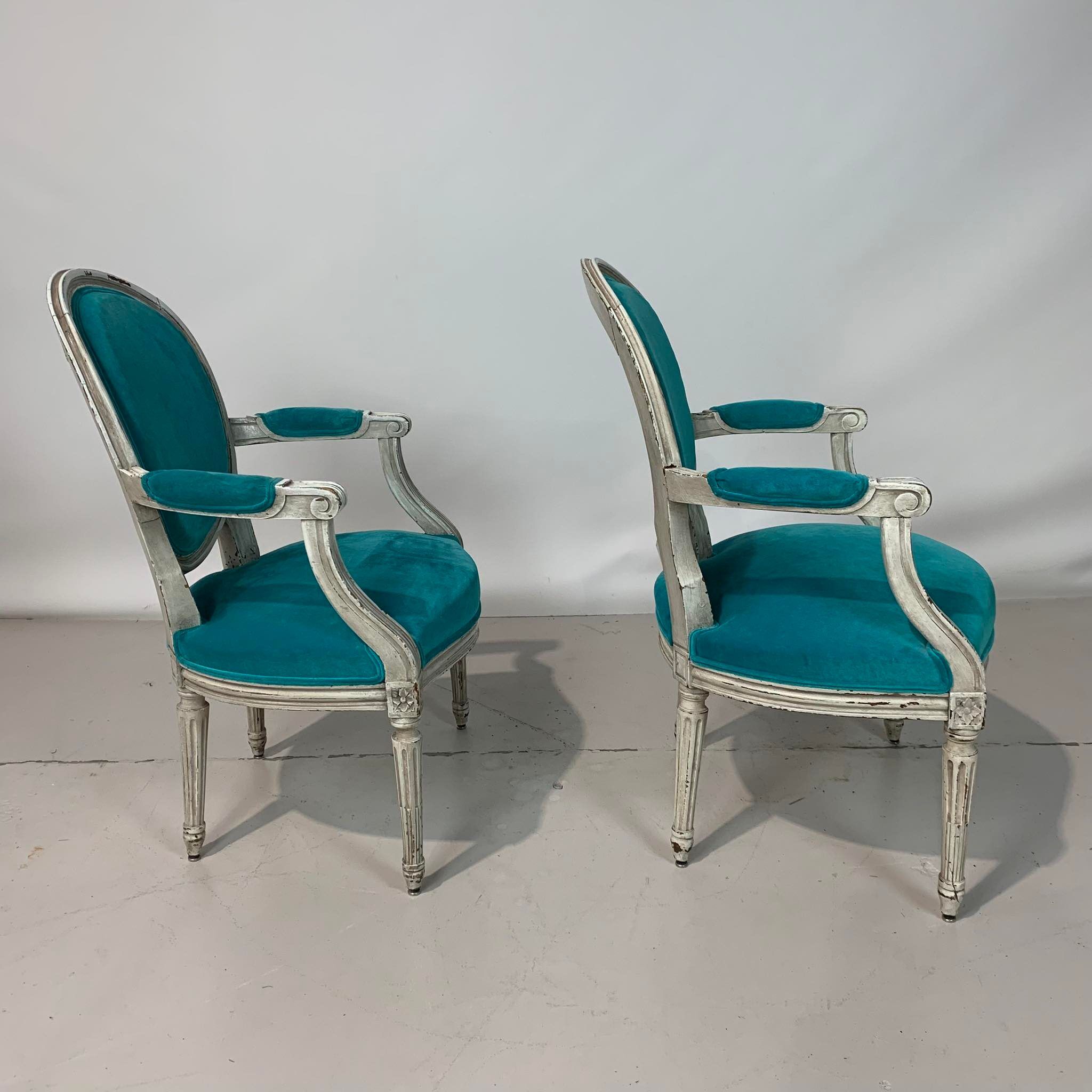 Pair of Louis XVI convertible armchairs
