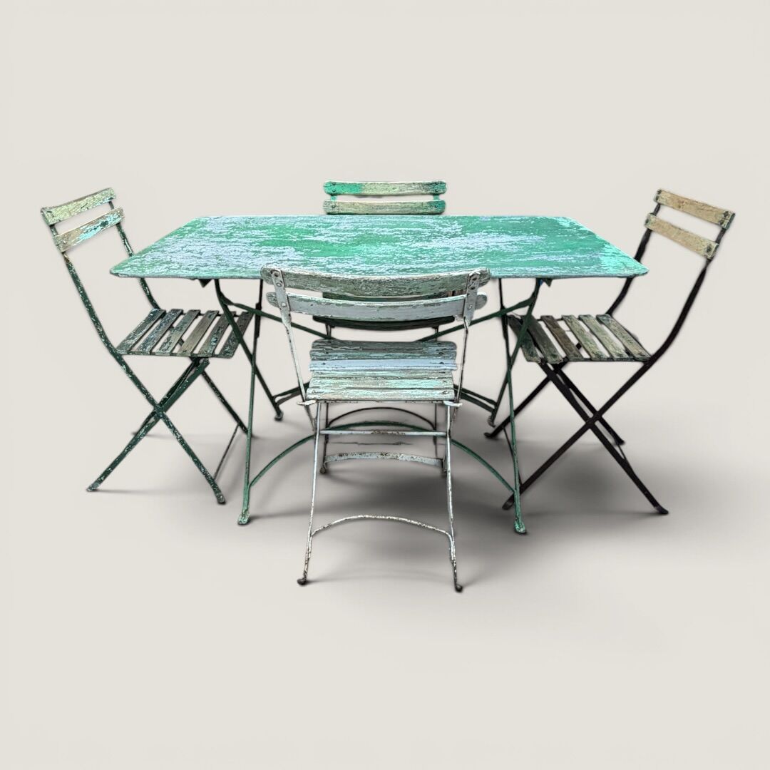 Bistro tables and folding chairs with a patina from the original 1930s.