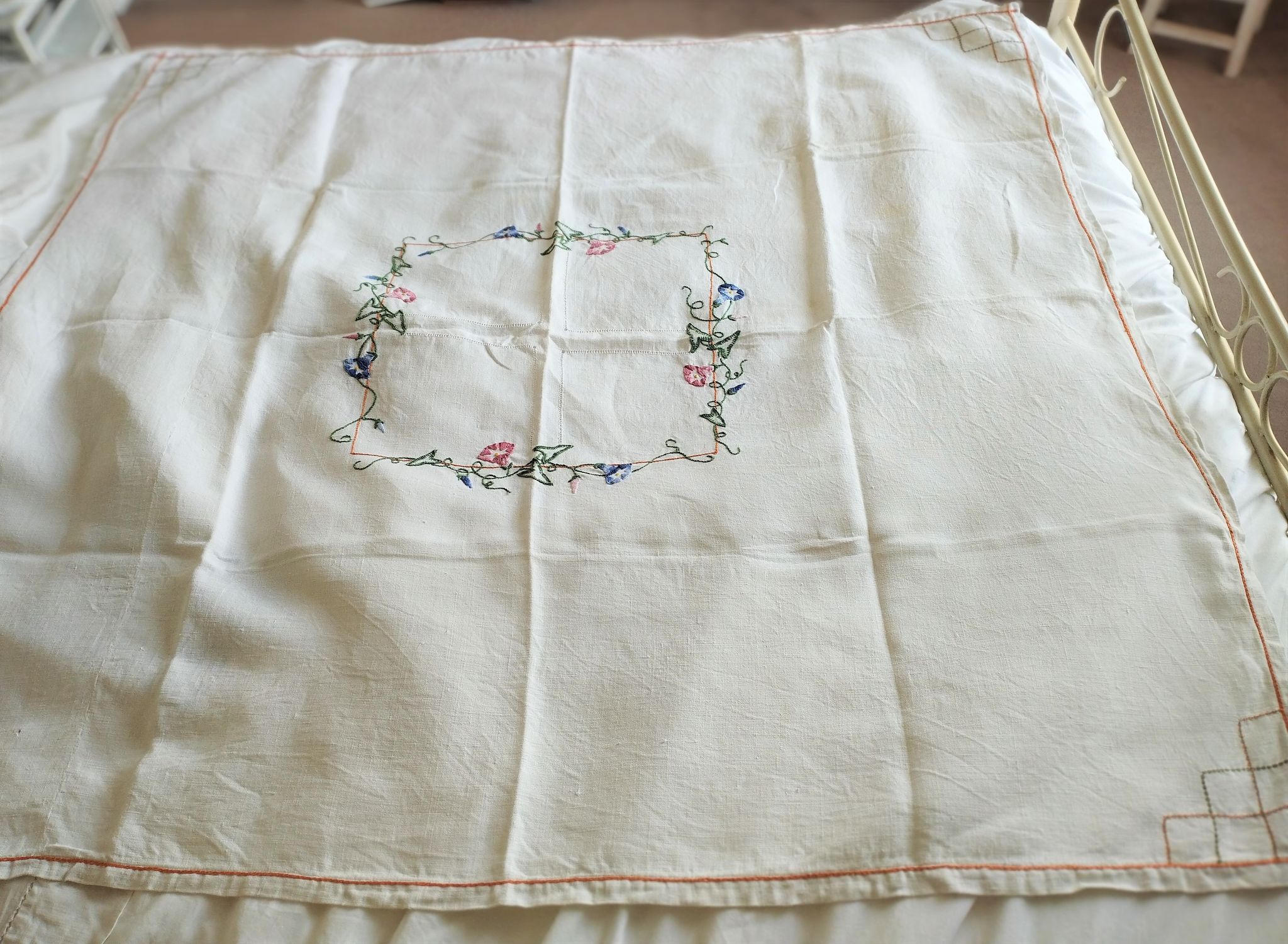 Antique linen tablecloth embroidered with flowers
