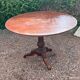 Old and large round winegrower's table made of wood.