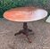 Old and large round winegrower's table made of wood.