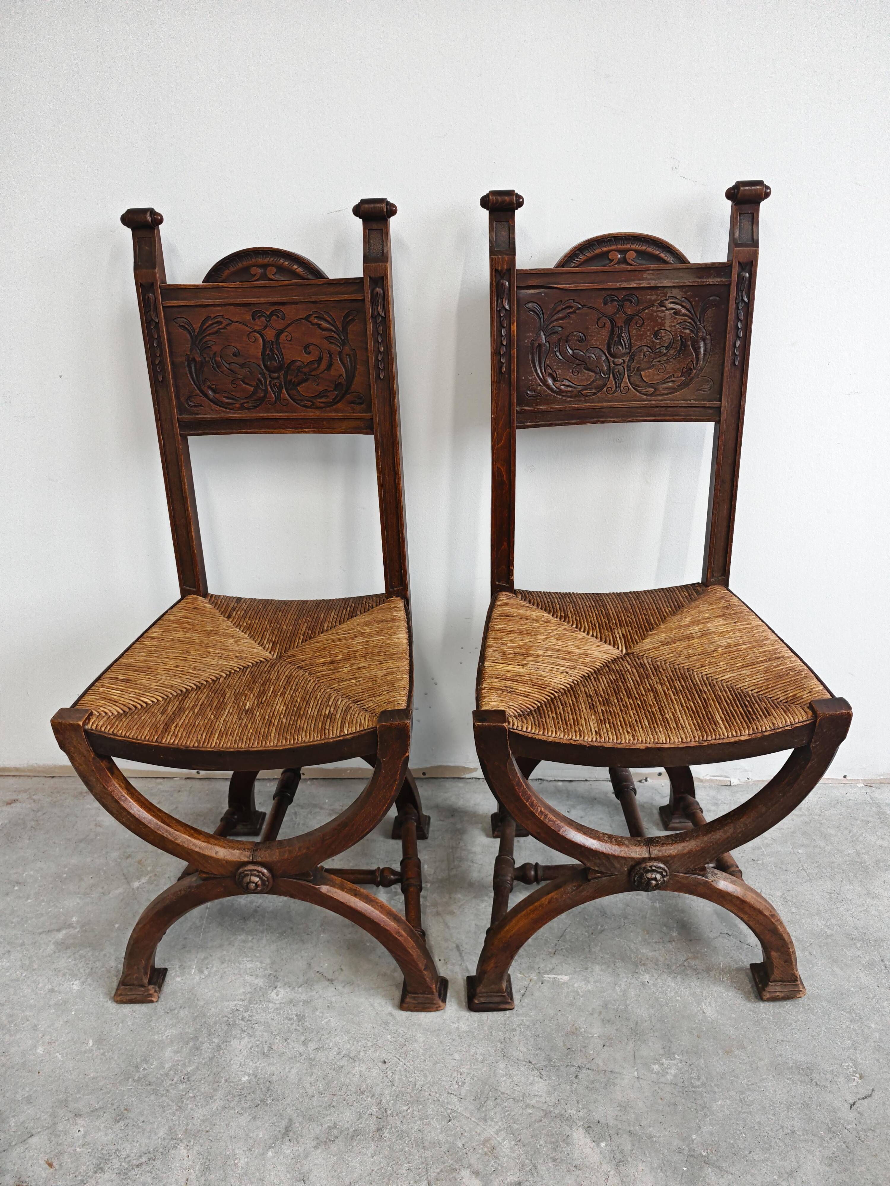Pair of Neo-Renaissance oak chairs with straw seats, 1910