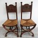 Pair of Neo-Renaissance oak chairs with straw seats, 1910