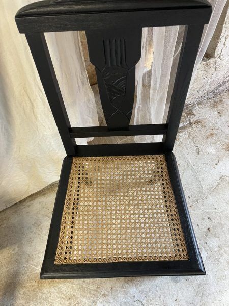 Black chairs and cannage