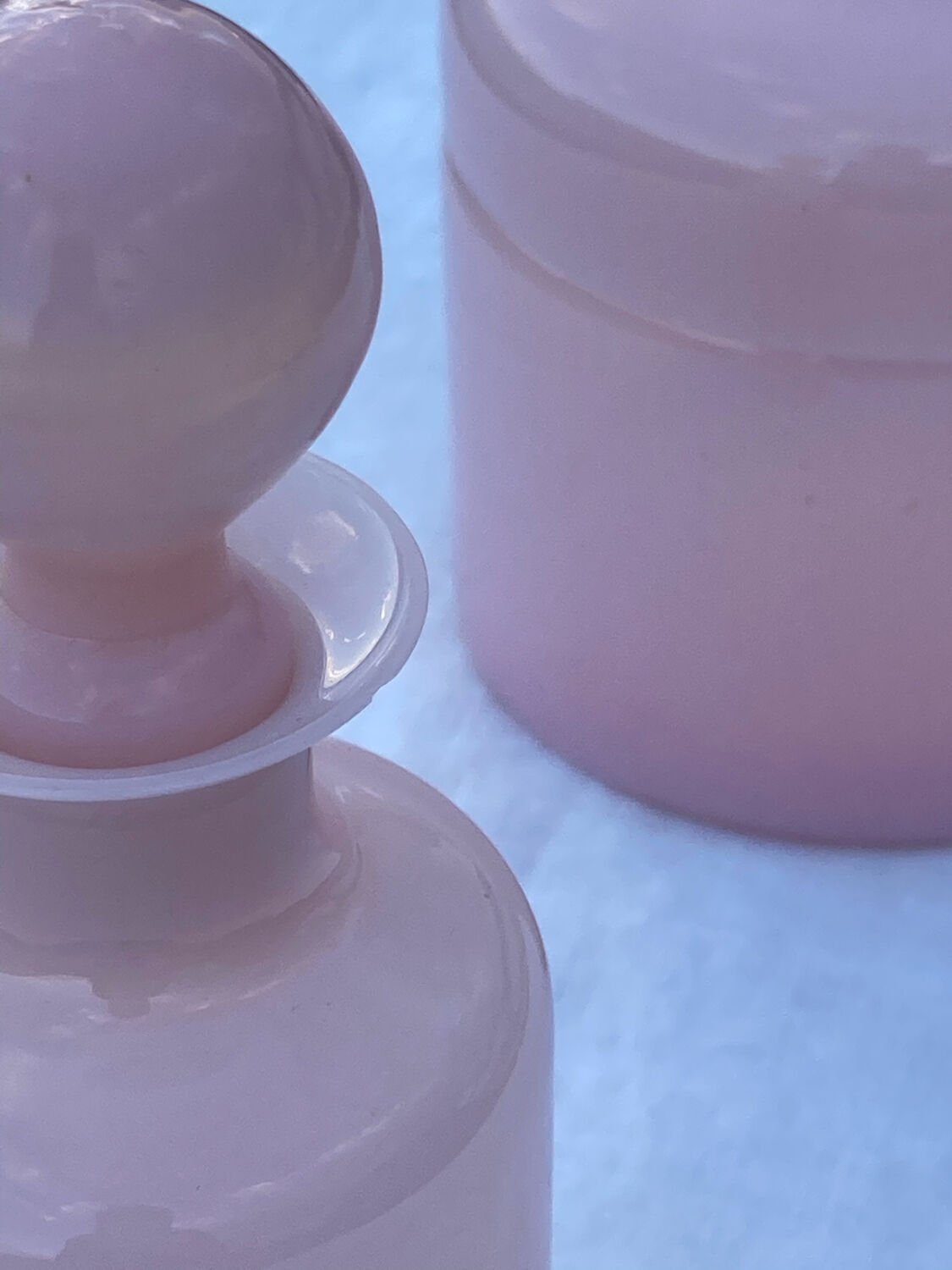 Two pink opaline bottles