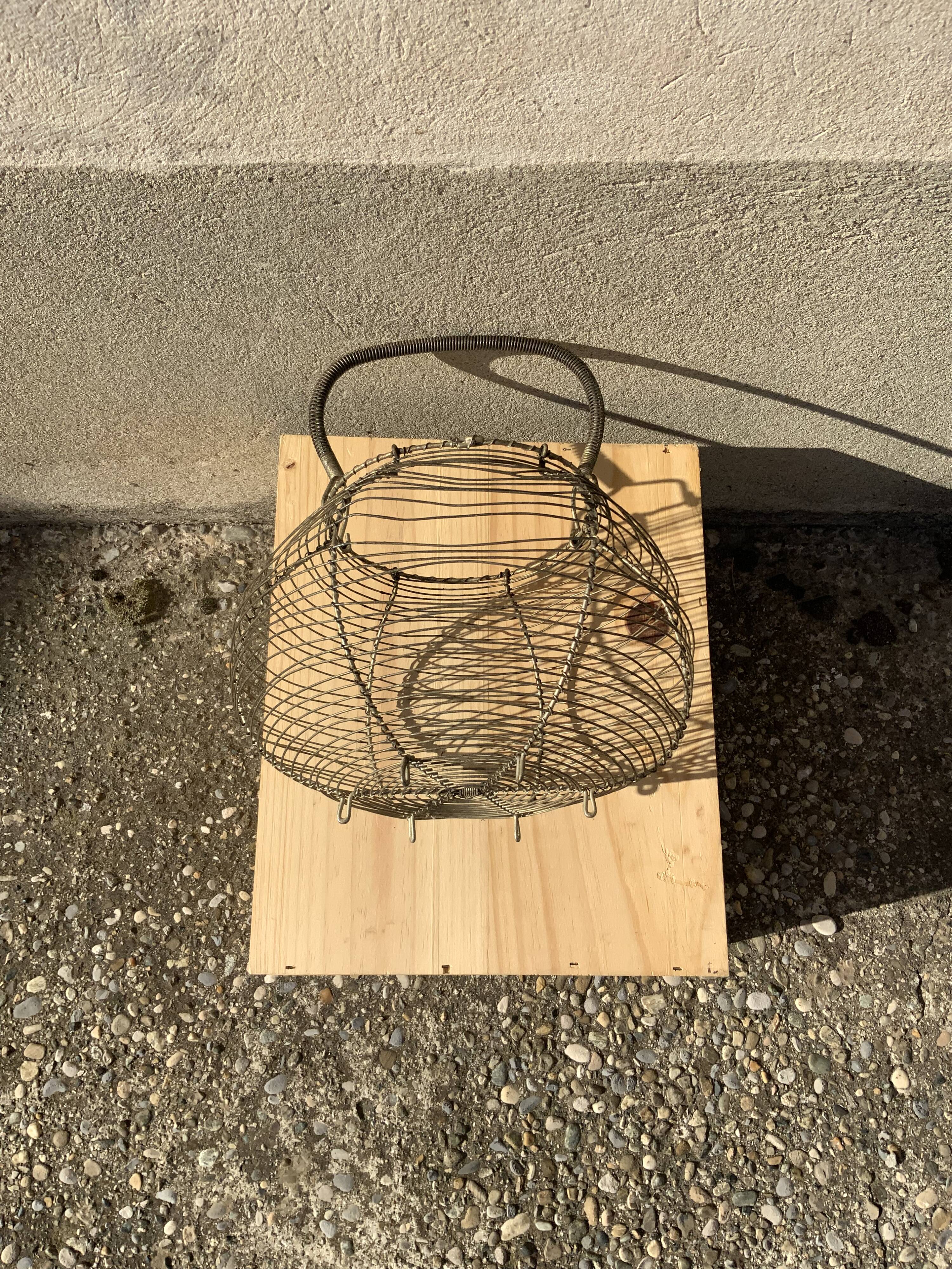 Vintage iron egg basket with hanse antique