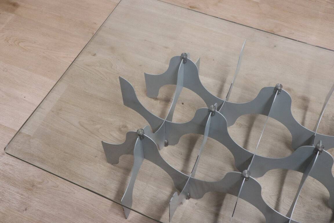 Minimalist sculptural coffee table in metal and glass