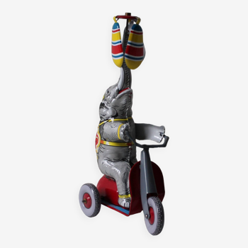 Vintage mechanical toys 'JW /Germany Western' 'Elephant on scooter'