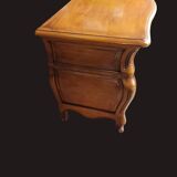 Solid wood commode in an antique style.