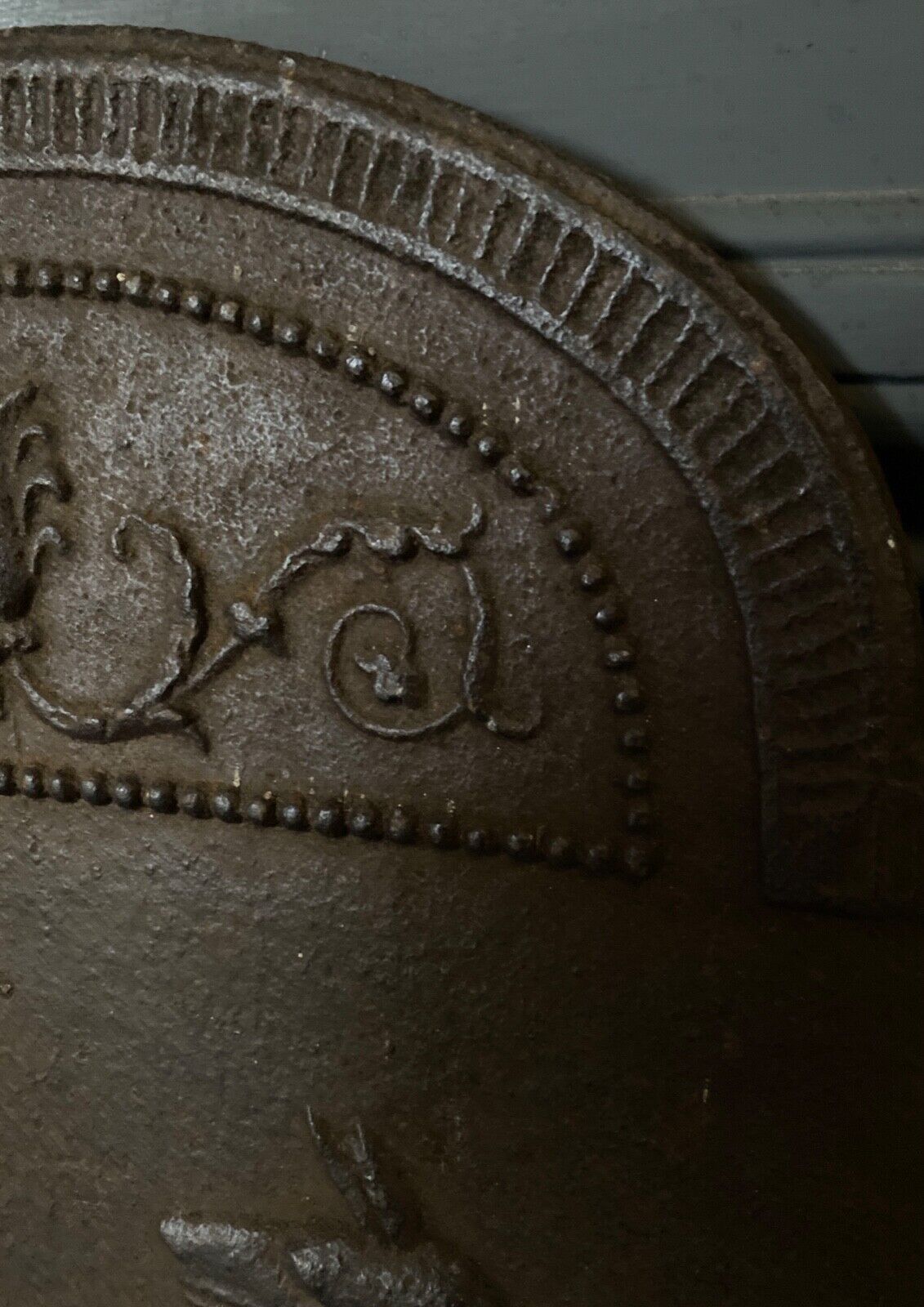 EIGHTEENTH CENTURY CAST IRON FIREPLACE PLATE REPRESENTING A WOMAN AND A WOLF