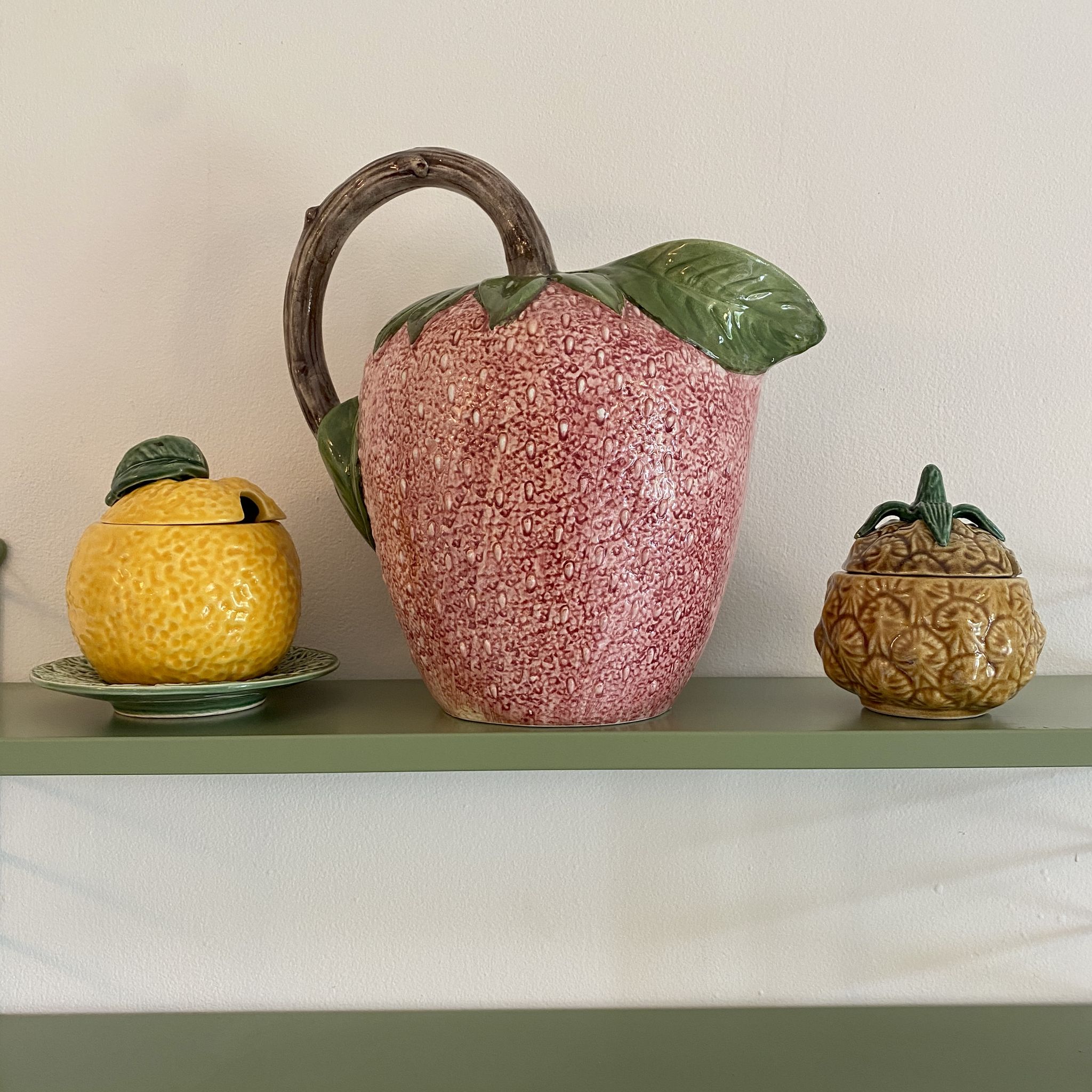 Set of ceramic fruits, a strawberry decanter and two lemon and pineapple jam jars