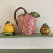 Set of ceramic fruits, a strawberry decanter and two lemon and pineapple jam jars