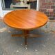Extendable round table in teak from the 60s with two extensions