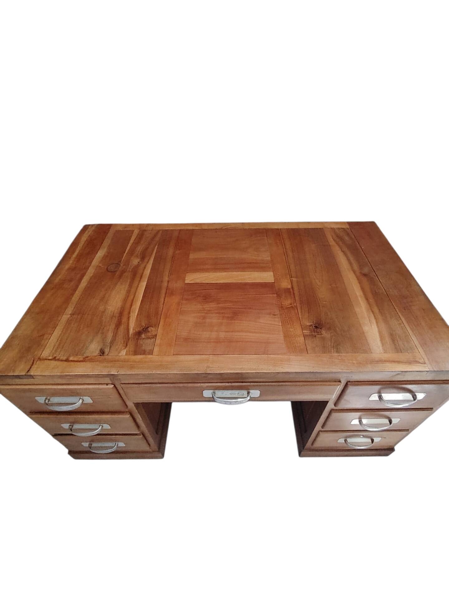 Large modernist minister's desk in solid lemon wood with 7 drawers.