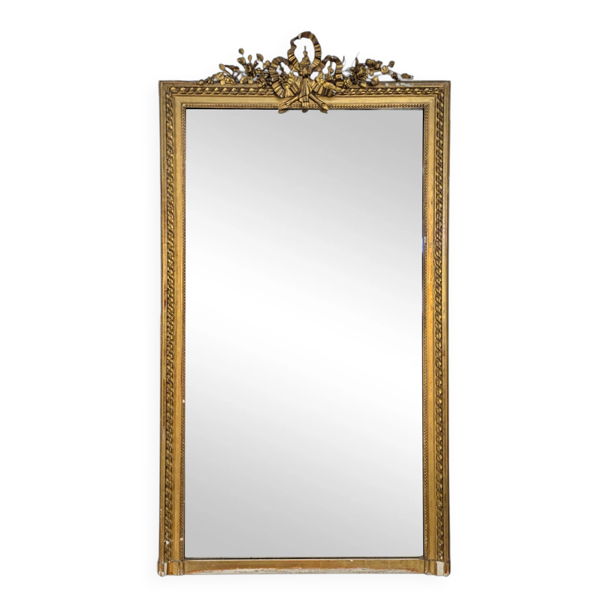 Golden Louis XVI style mirror with bouquet and shells.