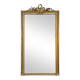 Golden Louis XVI style mirror with bouquet and shells.
