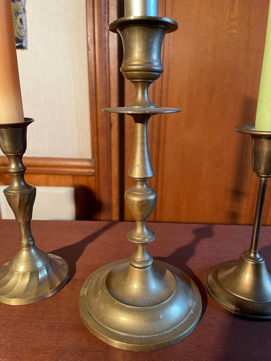 Trio of brass candlesticks