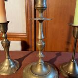 Trio of brass candlesticks