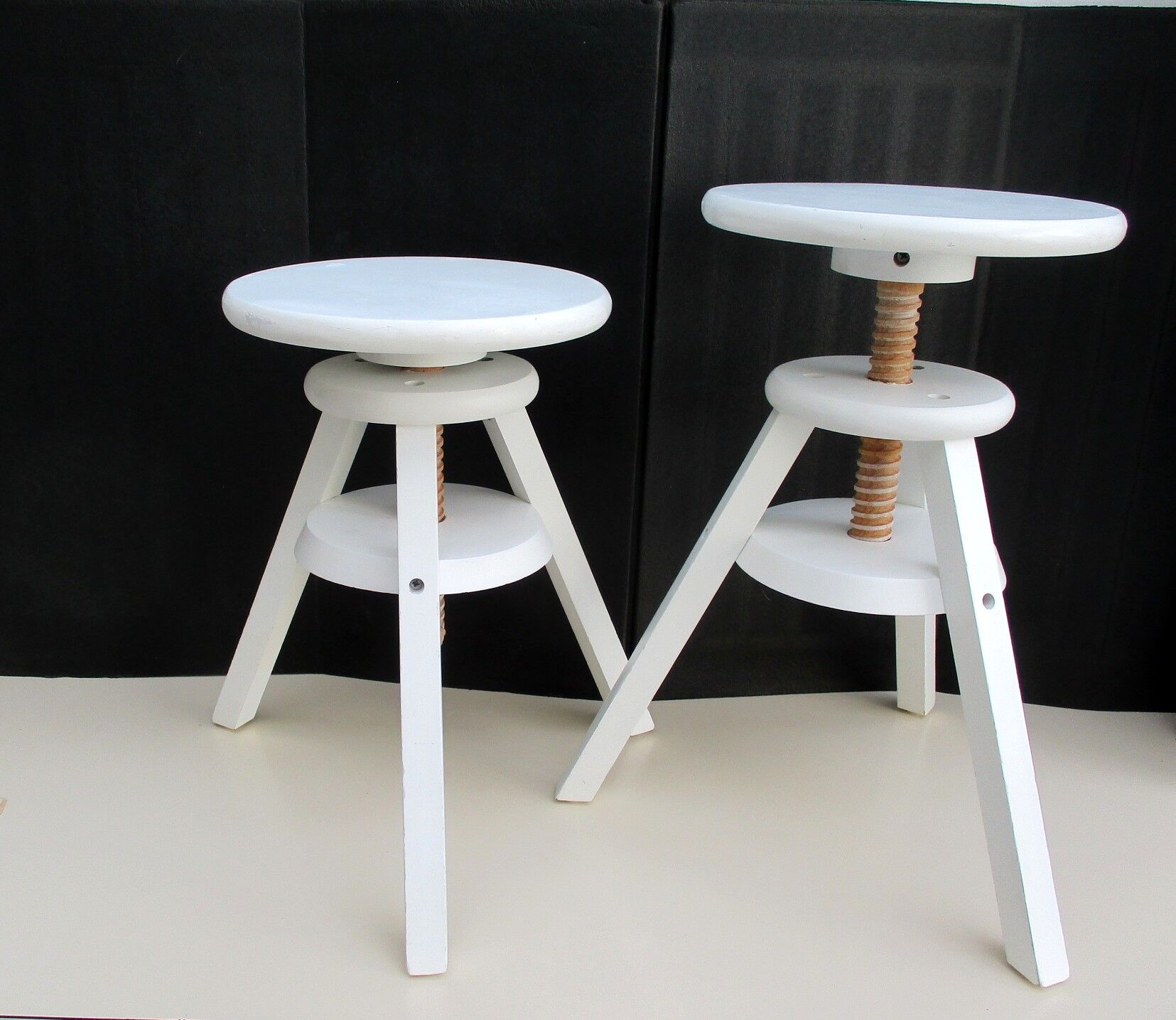 Two wooden screw stools for children